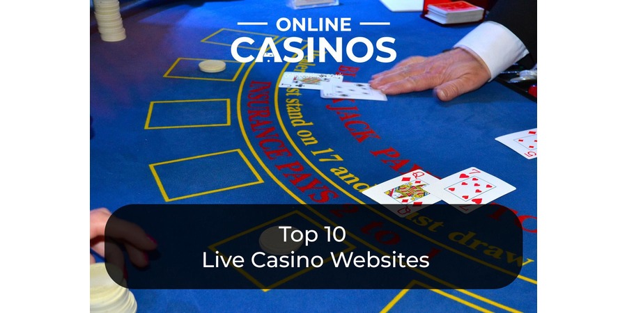 A casino dealer in a white shirt and black waistcoat stands in front of a gambling table 