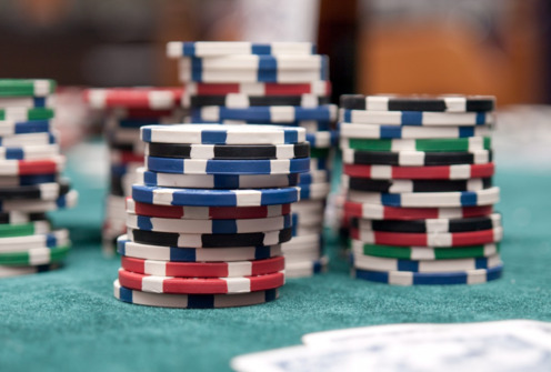 poker chips on green poker table