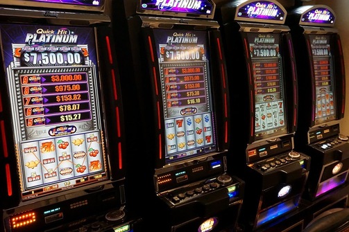 Four slot machines that say Quick Hit Platinum 7,500.00
